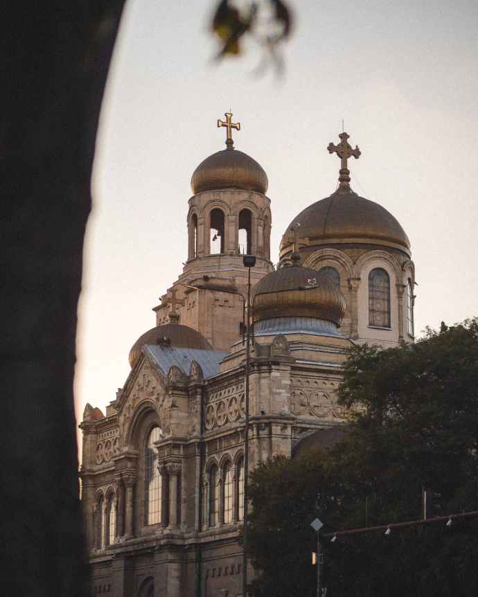 a large building with a cross on top of it